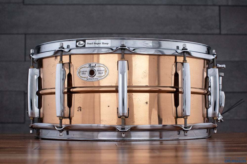 https://www.drumazon.com/cdn/shop/files/PEARL-14X6.5-SENSITONE-BRONZE-SNARE-DRUM-DRUMAZON_02_1000x.jpg?v=1684684296