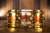 DW 14 X 5 COLLECTORS SPECIALITY EDGE BRASS MAPLE SNARE DRUM, AMBER OVER FLAME MAPLE, GOLD FITTINGS (PRE-LOVED)