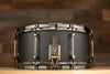 NOBLE & COOLEY 14 X 6.5 WALNUT PLY SNARE DRUM MATTE BLACK WITH WALNUT REVEAL BADGE AND BLACK CHROME FITTINGS