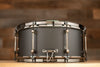 NOBLE & COOLEY 14 X 6.5 WALNUT PLY SNARE DRUM MATTE BLACK WITH WALNUT REVEAL BADGE AND BLACK CHROME FITTINGS