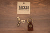 TACKLE TIMEKEEPERS DRUM KEY, MAHOGANY LEATHER, ANTIQUE BRASS KEY, SCRIPT BADGE